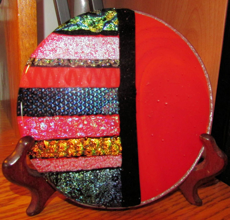 Fused plate in red, black and lots of dichroic glass